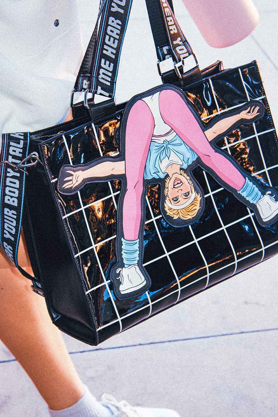 Closeup on Graphic Tote Bag with Olivia Newton-John Illustration and Physical Let Me Hear Your Body Talk Lyrics