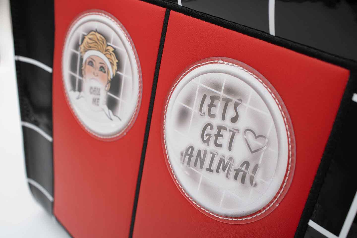 Back of Graphic Tote Bag with Olivia Newton-John Illustration and Physical Let's Get Animal Lyrics