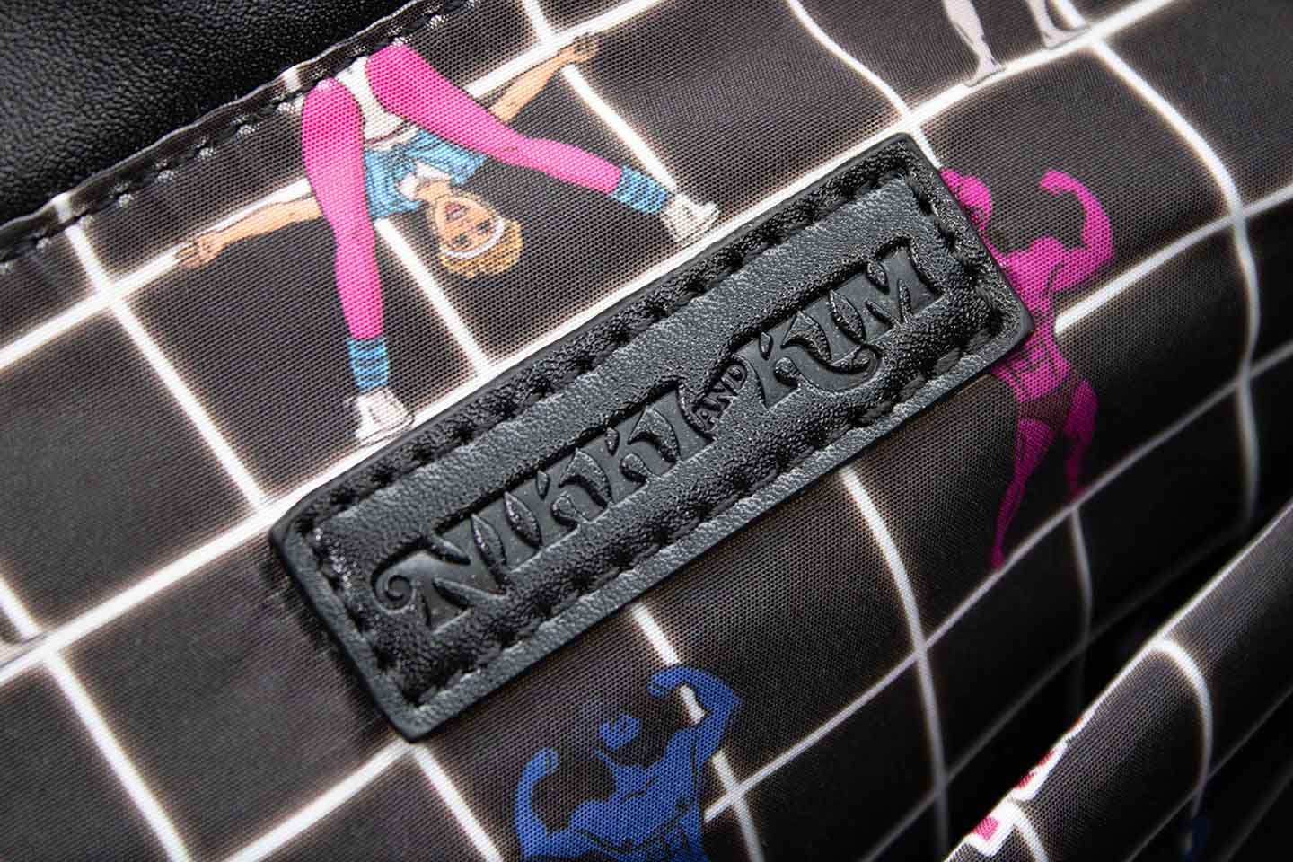 Closeup on Logo in Graphic Tote Bag with Olivia Newton-John Illustration and Physical Let Me Hear Your Body Talk Lyrics