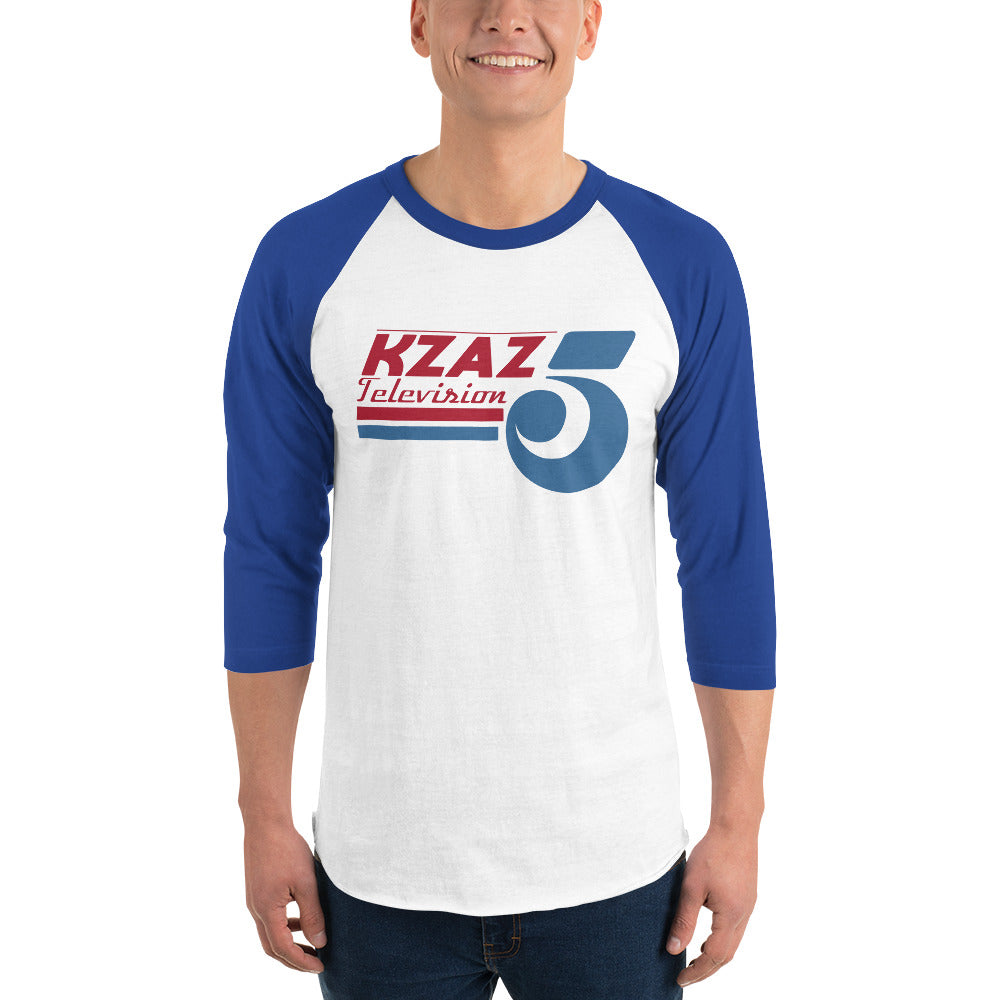 Man Wearing Graphic Raglan Shirt of Grease Movie KZAZ TV Station Logo