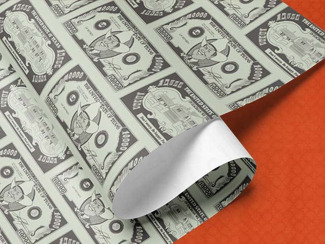 Money-themed wrapping paper roll with Larry Hagman as JR Ewing of Dallas TV Series