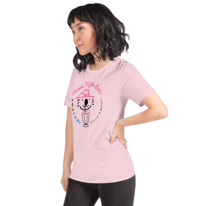 Side View of Woman Wearing Pink-Colored Graphic T-Shirt with Koala Blue Aussie Milk Bar Logo Inspired by Olivia Newton-John’s 1980’s Clothing Brand