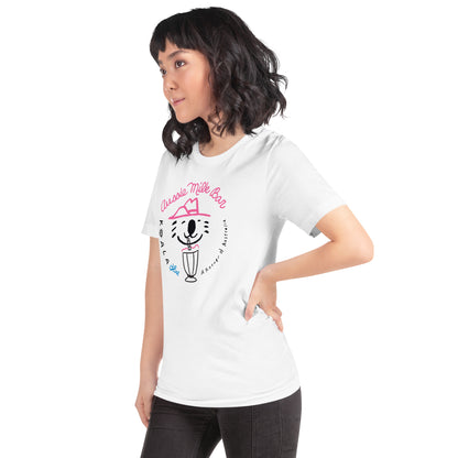 Side View of Woman Wearing White-Colored Graphic T-Shirt with Koala Blue Aussie Milk Bar Logo Inspired by Olivia Newton-John’s 1980’s Clothing Brand