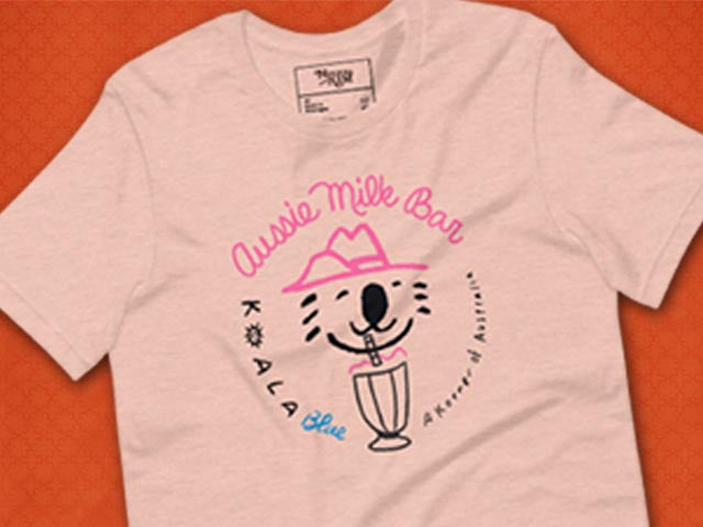 Graphic T-Shirt with Koala Blue Aussie Milk Bar Logo Inspired by Olivia Newton-John’s 1980’s Clothing Brand