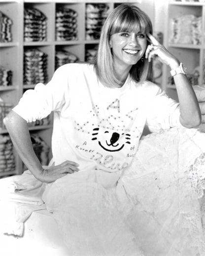 Olivia Newton-John Wearing Original Graphic Shirt with Koala Blue Logo from her 1980’s Clothing Brand