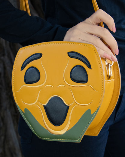 Woman Wearing Novelty Purse in the Shape of a Pumpkin Inspired by Disney's Carousel of Progress