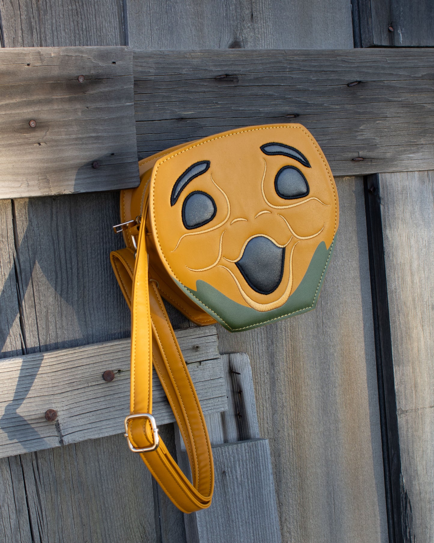 Novelty Purse in the Shape of a Pumpkin Inspired by Disney's Carousel of Progress with wood background