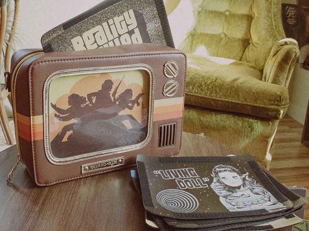 1970’s Style Retro TV Purse with Interchangeable Screens on Table