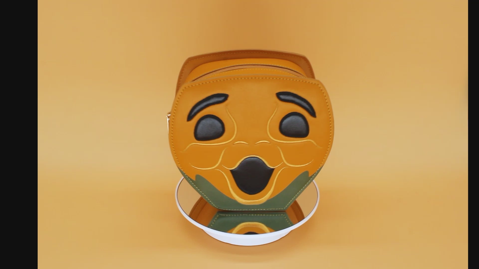 Video Showcasing Progress-Pumpkin-Purse rotating on orange background